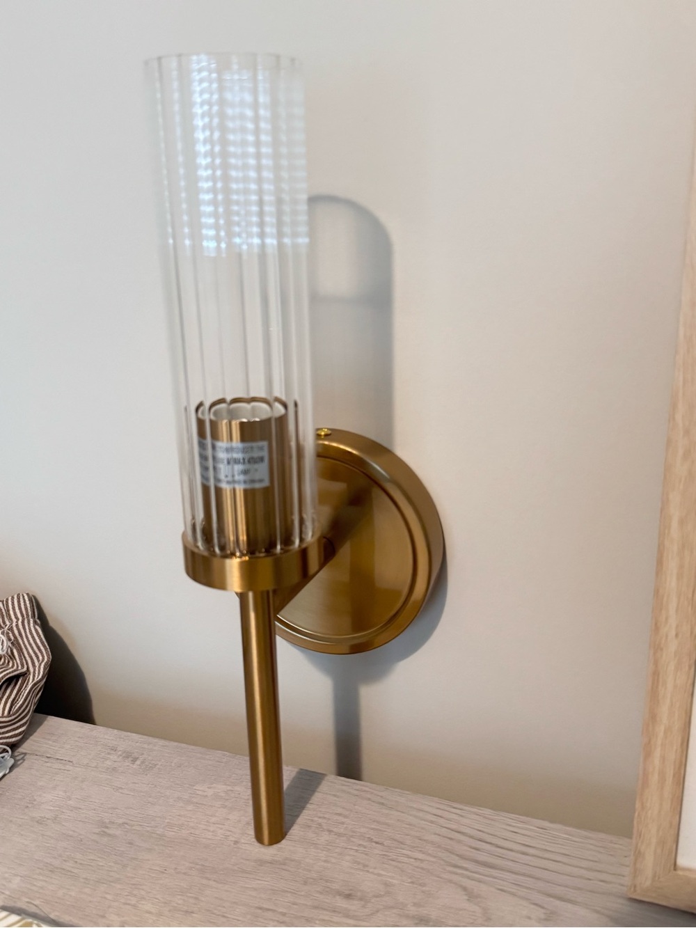 Gold wall sconce- wired. New in box